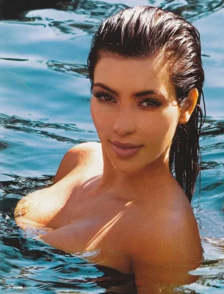 Kim-Kardashian-topless-in-pool.webp
